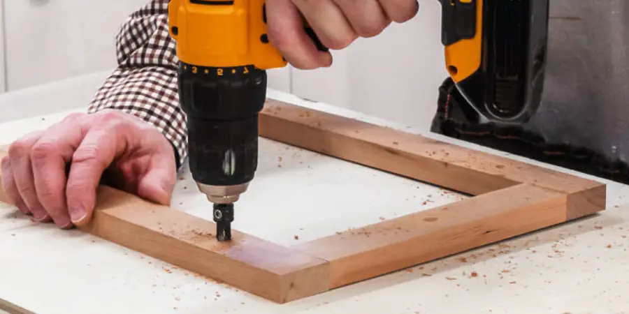 make a hole in picture frame with drill